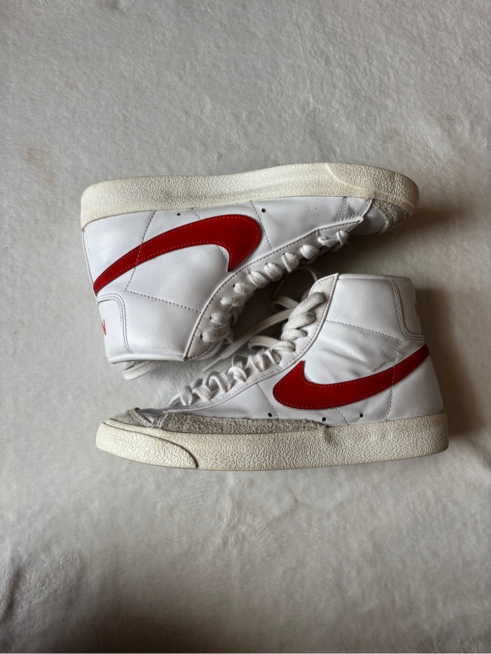 Nike White High-Top Sneakers with Red Swoosh